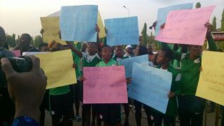 (Photo) Super Falcons Block Entrance To NASS; Arsenal Striker Oshoala Plays Judas